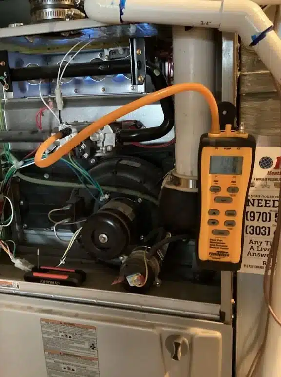 Homegrown technician running diagnostics on an HVAC system